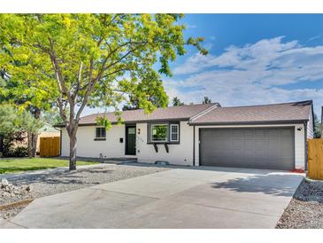 Charming single-story home featuring a well-maintained lawn and a two-car attached garage at 1226 W 98Th Ave, Northglenn, CO 80260