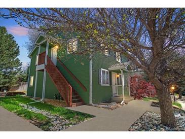 Charming two-story home with a private entrance and lush landscaping surrounding the property at 3228 W Girard Ave # C, Englewood, CO 80110