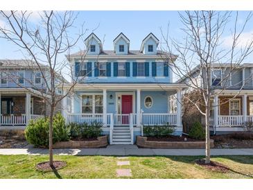 Charming two-story home with a welcoming porch and colorful blue exterior at 3465 Beeler Ct, Denver, CO 80238
