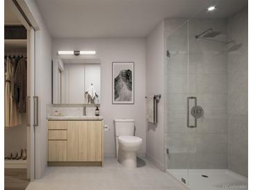 Modern bathroom featuring a glass enclosed shower, wood vanity, and sleek fixtures at 525 18Th St # 1210, Denver, CO 80202