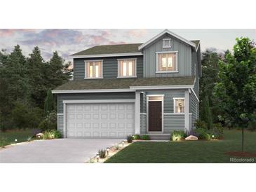 Charming two-story home with a well-manicured lawn, lovely landscaping and an attached two-car garage at 2145 Flower Blossom Ave, Brighton, CO 80601
