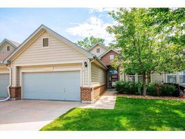 Charming home with a two-car garage, manicured lawn and mature shade tree at 2870 W Riverwalk Cir # B, Littleton, CO 80123