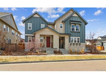 Charming two-story home with a landscaped front yard and inviting entryways at 5687 Dayton St, Denver, CO 80238