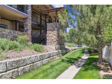 Multi-story condo with brick facade and well-maintained landscaping at 875 E 78Th Ave # 7, Denver, CO 80229