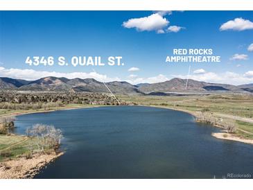 Scenic aerial view of 4346 S. Quail St. near Red Rocks Amphitheatre and a tranquil lake at 4346 S Quail St, Littleton, CO 80127