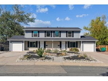 Updated triplex with landscaped front yards and attached garages at 9141 Osceola St, Westminster, CO 80031