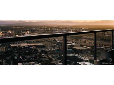 Stunning city view showcasing the skyline and mountains from a high rise balcony with black railings at 1133 14Th St # 3430, Denver, CO 80202