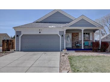 Charming single-Gathering home with a two-car garage, covered porch, and well-maintained landscaping at 4361 Kirk Ct, Denver, CO 80249