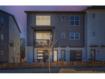 Charming, modern two-story home with eye-catching curb appeal and a small, cozy balcony at 2052 Alcott Way, Broomfield, CO 80023