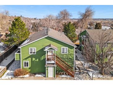 Green exterior of a duplex with stairs and landscaping at 3226 W Girard Ave # D, Englewood, CO 80110