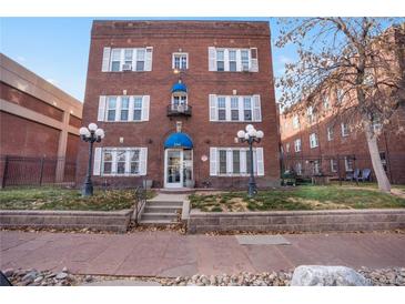 Attractive brick apartment building with landscaping and well-maintained grounds at 1341 N Washington St # 4, Denver, CO 80203
