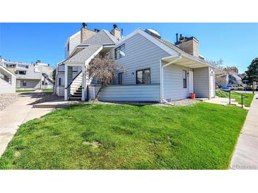 Charming condo with well-maintained lawn and appealing exterior in a sunny neighborhood at 17003 E Tennessee Dr # 209, Aurora, CO 80017