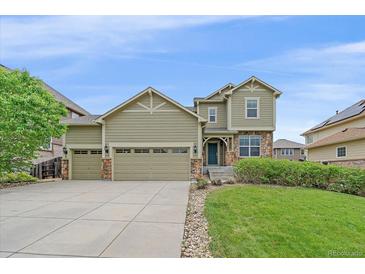 Charming two-story home featuring a three-car garage and well-manicured lawn at 6461 S Ider St, Aurora, CO 80016