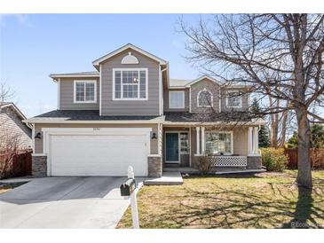 Charming two-story home with a well-maintained lawn and inviting front porch at 5174 W 123Rd Pl, Broomfield, CO 80020