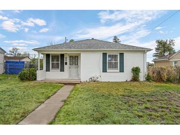 Charming home featuring white exterior and well-maintained lawn at 3715 N Jackson St, Denver, CO 80205