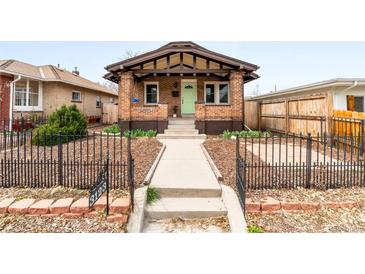 Charming brick home with a well-maintained front yard and inviting entryway at 3123 N Elizabeth St, Denver, CO 80205