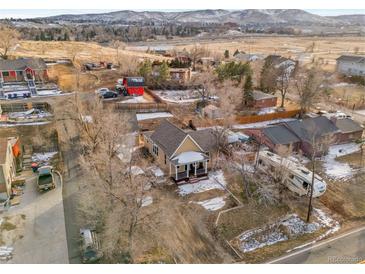 Aerial view of a property showcasing the house, yard, surrounding neighborhood, and proximity to amenities at 14050 W 8Th Ave, Golden, CO 80401