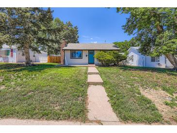 Charming home with a well-manicured lawn, inviting walkway, and a striking blue front door at 2625 S Linley Ct, Denver, CO 80219