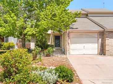 Charming home with a well-maintained front yard, mature tree, and a one car garage at 633 W 114Th Way, Northglenn, CO 80234