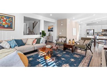 Comfortable living area with stylish decor and an open layout, perfect for entertaining and relaxation at 8353 Bijou Creek Ave, Littleton, CO 80125