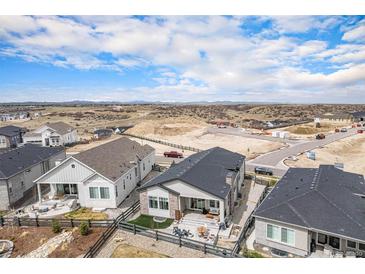 Desirable lot offering a spacious backyard with a patio surrounded by mountain views at 7202 Canyonpoint Rd, Castle Pines, CO 80108