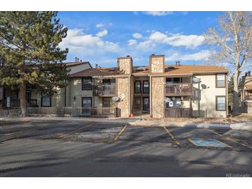 Attractive exterior of a two-story condo building with parking at 7820 W 87Th Dr # K, Arvada, CO 80005