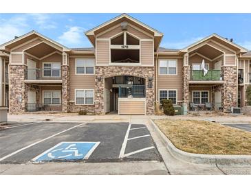 Attractive multi-Gathering home with stone accents, balconies, and accessible parking at 10715 Twenty Mile Rd # 203, Parker, CO 80134