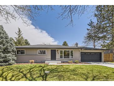 Charming, well-maintained single-story home with a tidy front yard, mature trees and painted brick facade at 3576 S Holly St, Denver, CO 80237