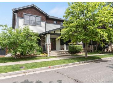 Charming two-story home with landscaped front yard, covered porch, and stone accents at 3858 W 117Th Ct, Westminster, CO 80031
