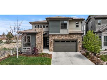 Stunning two-story home featuring stone accents, neutral siding and a two-car garage at 507 Red Thistle Dr, Highlands Ranch, CO 80126