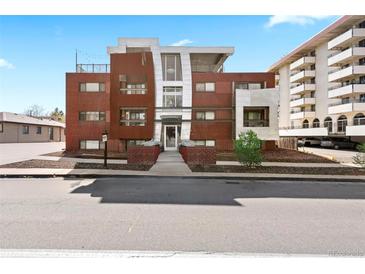 Attractive brick apartment building with modern architectural details and well-maintained landscaping at 75 N Emerson St # 206, Denver, CO 80218