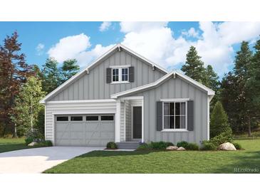 Craftsman style home with gray siding, white trim, and a two-car garage at 1121 Joseph Pl, Erie, CO 80026