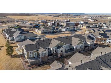 Beautiful aerial view of a residential neighborhood featuring well-maintained homes and landscaping at 14434 W 88Th Dr # B, Arvada, CO 80005