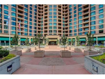 Attractive condominium complex with brick facade and inviting courtyard entrance at 8100 E Union Ave # 1502, Denver, CO 80237