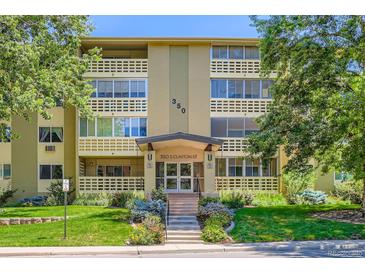 A full shot of 350 S Clinton St showing the beautifully landscaped exterior with brick design and a clean lush lawn at 350 S Clinton St # 9B, Denver, CO 80247