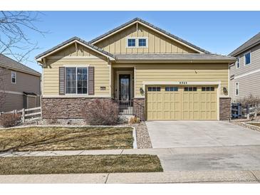 Charming single-Gathering home with a two-car garage, stone accents, and well-maintained front yard at 3325 Yale Dr, Broomfield, CO 80023