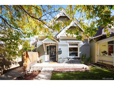 Charming craftsman home with a well-manicured lawn and inviting front porch at 1152 Clayton St, Denver, CO 80206