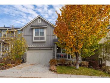 Two-story home with gray siding, attached garage, and autumn landscaping at 1867 W 137Th Ln, Broomfield, CO 80023