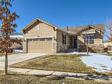 Charming single-Gathering home with a two-car garage and stone accents at 4561 Hope Cir, Broomfield, CO 80023