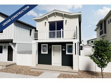 Charming two-story home with a balcony and a combination of dark and white siding. Landscaping is minimal, under construction at 13139 E 103Rd Pl, Commerce City, CO 80022