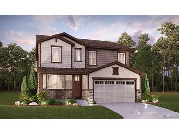 Charming two-story home with a covered porch, two-car garage, and manicured front lawn at 24707 E 40Th Ave, Aurora, CO 80019