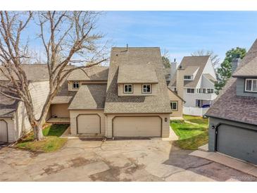 Charming townhome with two-car garage and neutral exterior color at 8008 W Spanish Peak, Littleton, CO 80127