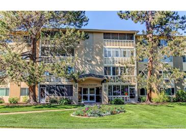 Attractive building exterior with landscaping and entrance at 725 S Alton Way # 4D, Denver, CO 80247