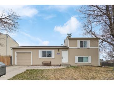 Charming two-story home with neutral-colored exterior, attached garage, and inviting front entrance at 10405 W 107Th Pl, Broomfield, CO 80021