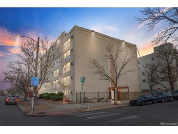 Exterior view of a multi-story building featuring modern architecture and well-maintained landscaping at 1390 N Emerson St # 106, Denver, CO 80218