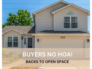 Charming two-story home with a well-manicured lawn and inviting curb appeal at 606 Beth Ave, Fort Lupton, CO 80621