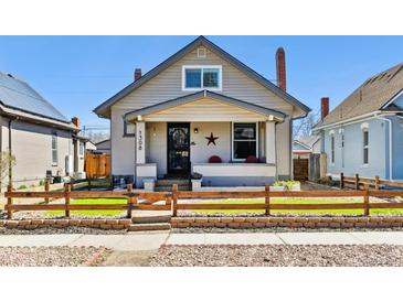 Charming single-story home with a well-maintained lawn and inviting front porch at 1308 S Sherman St, Denver, CO 80210