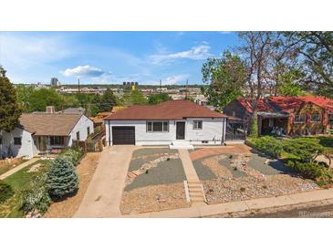 Charming home with a one-car garage, professional landscaping, and a cozy, inviting curb appeal at 716 S Osage, Denver, CO 80223
