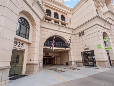 Facade with arched entrance to a parking garage featuring Italian restaurant and a glass-enclosed vestibule at 925 N Lincoln St # 12G, Denver, CO 80203