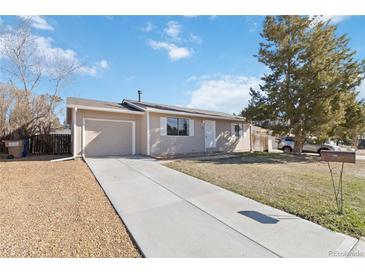 Charming single-story home featuring a one-car garage and long driveway at 3270 W 134Th Ave, Broomfield, CO 80020